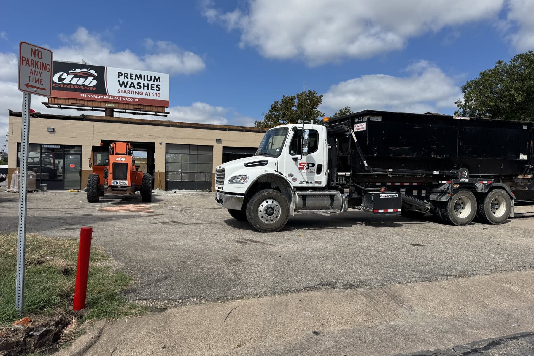 S&P Dumpsters roll-off container at a commercial job site in Waco, TX